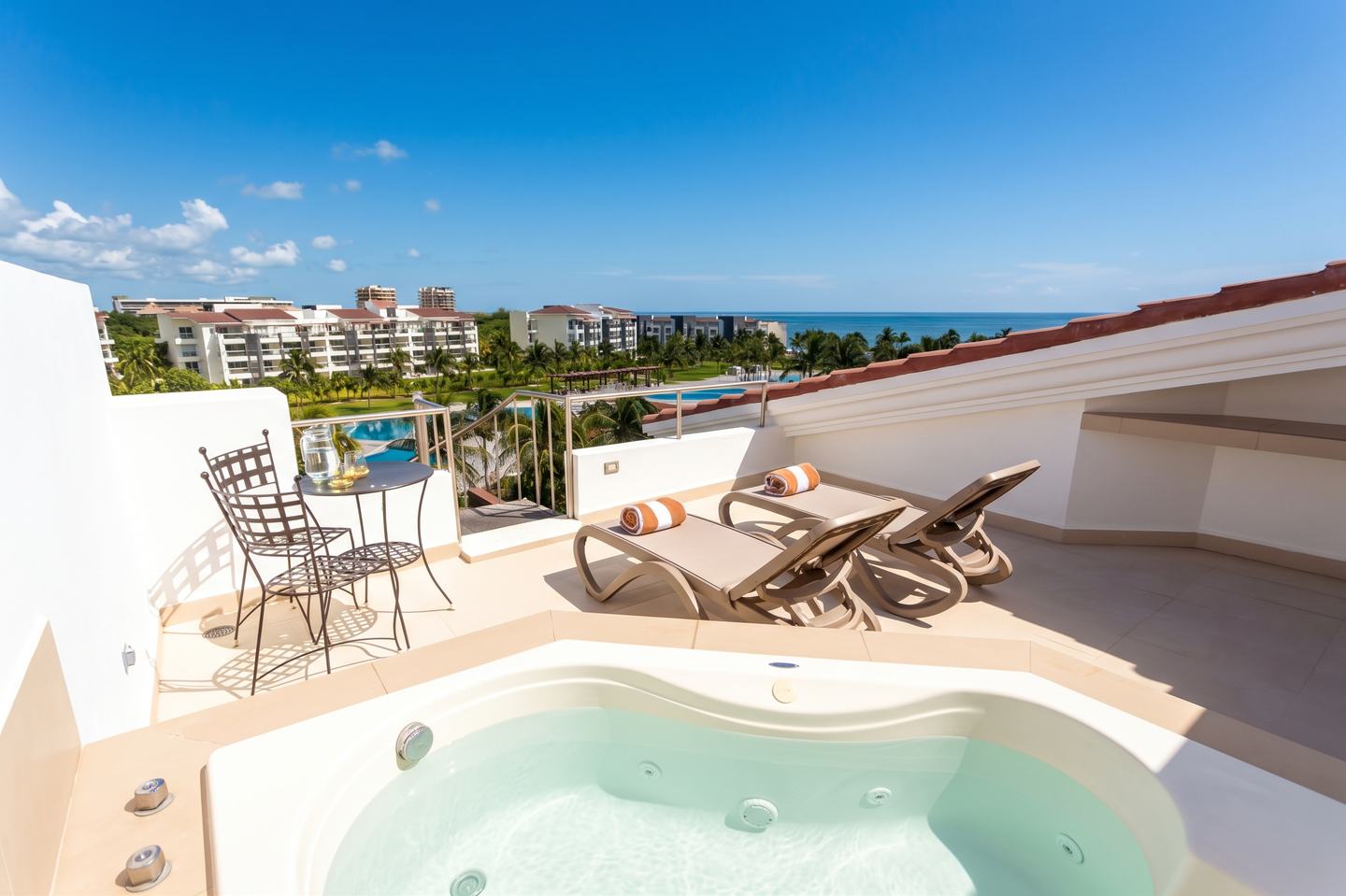 Private rooftop terrace with jacuzzi and lounge chairs